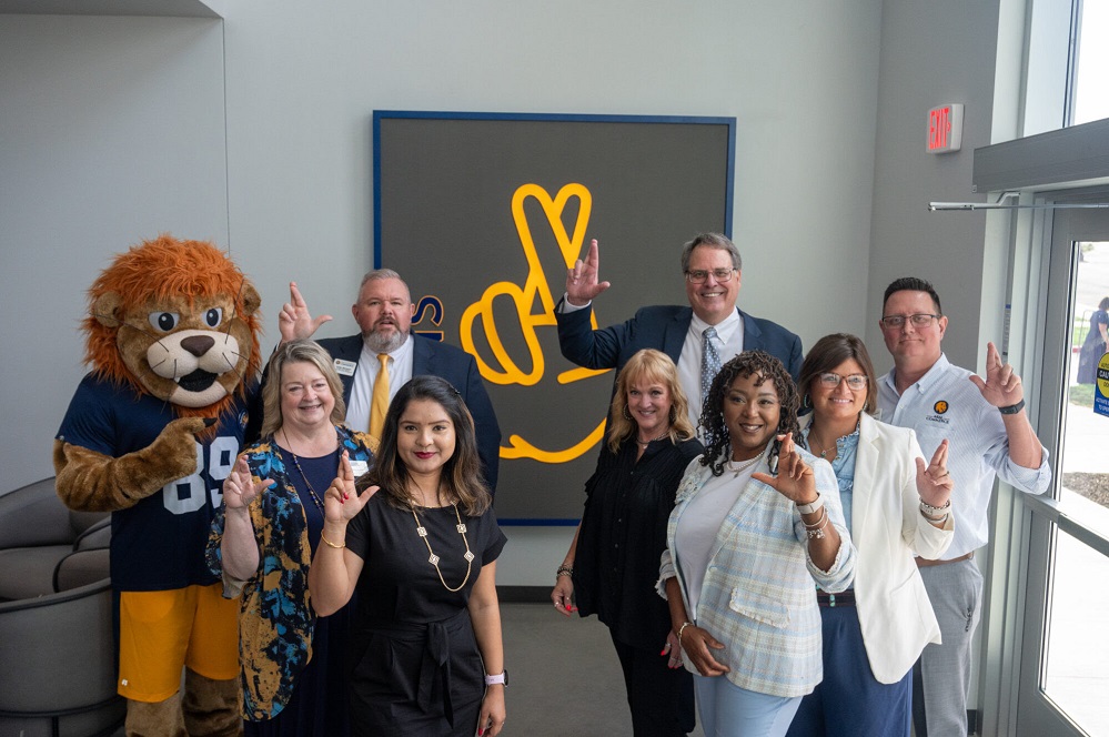 A&M-Commerce staff and Lucky in the new Student Services Building and Welcome Center Photo by Paul Bryan A&M-Commerce Office of Marketing and Communications