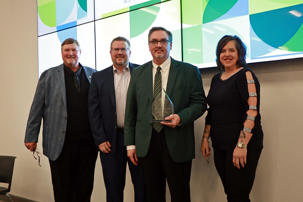 Photo cutline GV-Banquet-PJC-Award-2-7-25: From left are Greenville Board of Development Chair Holly Gray, GBOD Business Development Director John Dickson, PJC President Dr. Stephen Benson, and GBOD President / CEO Greg Sims at the award presentation.