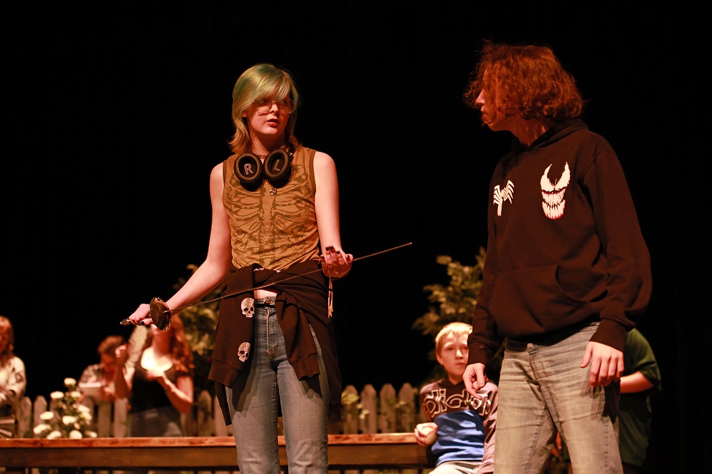 Page & Romeo: Emma Davis as Page presents a sword to Kai Fornof, playing Romeo.